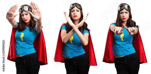 Set of Pretty superhero girl making NO gesture © luismolinero