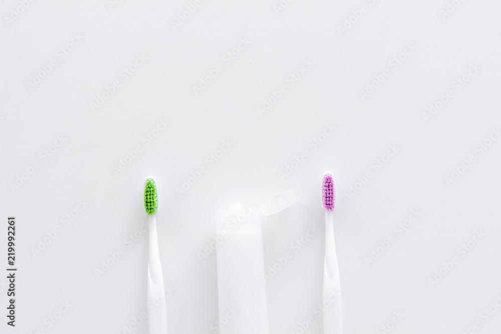 Clean teeth. Toothbrushes and tooth paste on white background top view space for text Clean teeth. Toothbrushes and tooth paste on white background top view space for text