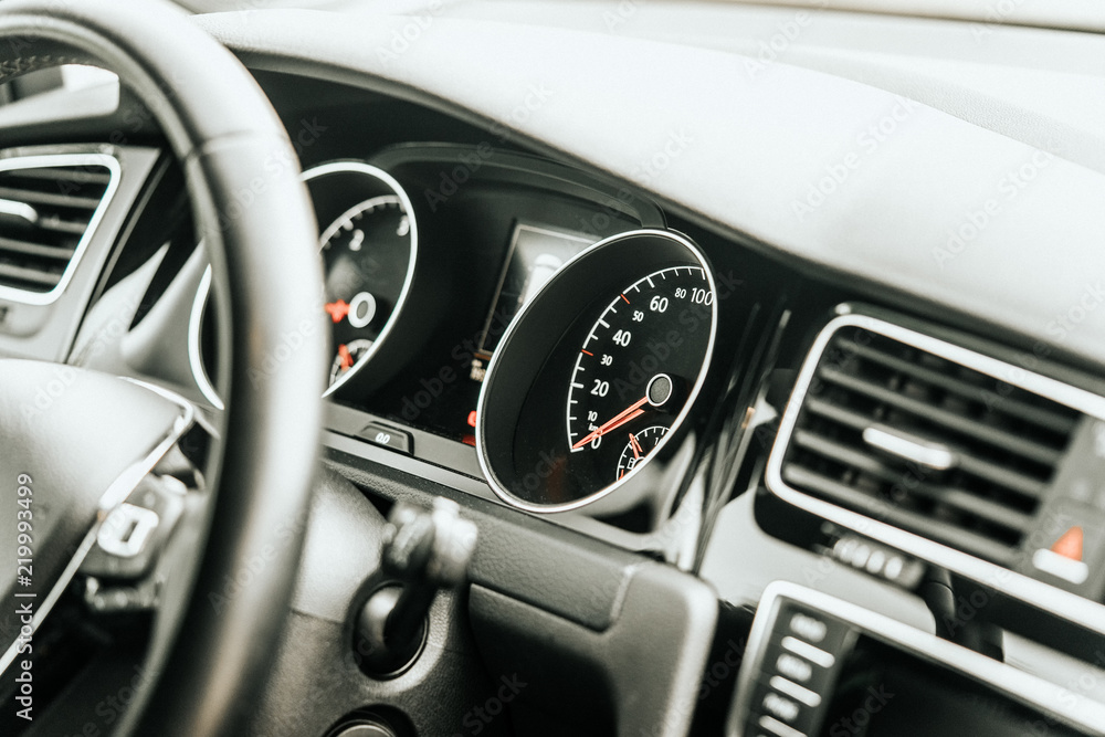 Close up modern vehicle dashboard interior speedometer
