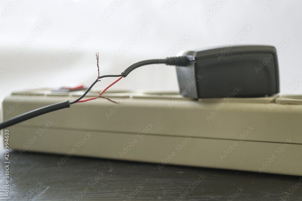 Charging for a smartphone with bare wires. Charging for a smartphone with bare wires.