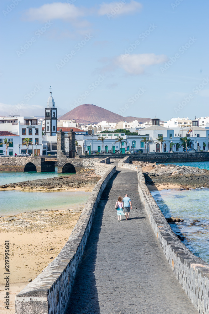 A couple walking to the city center of Arrecife, Lanzarote, Spain