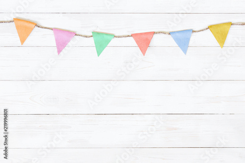 Festive white wooden background with garland
