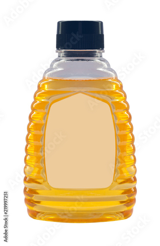 Plastic bottle with honey isolated on a white background