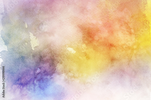 Colorful watercolor ombre leaks and splashes texture on white watercolor paper background. Natural organic shapes and design.