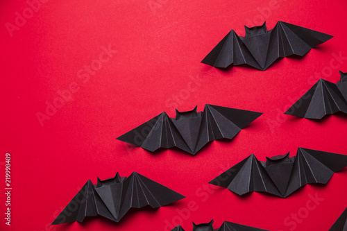Fototapeta Halloween bats made from paper on a red background