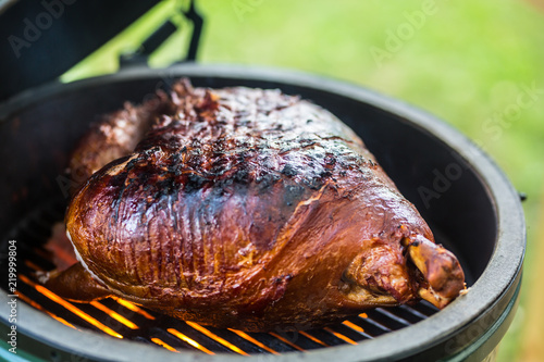 Photography Grilled and smoked pork meat on professional grill.