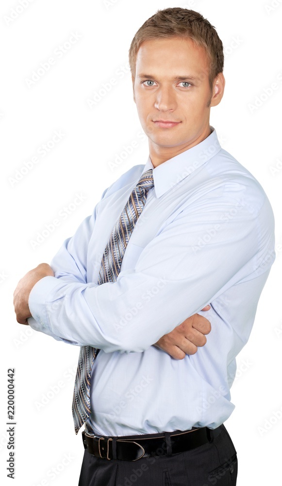 Professional looking man with his arms crossed wearing a shirt Professional looking man with his arms crossed wearing a shirt