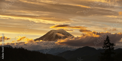 Mt Rainier at sunset with golden clouds