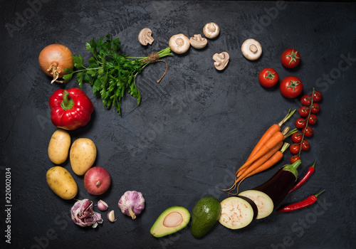 Fresh vegetables on a black background with text space