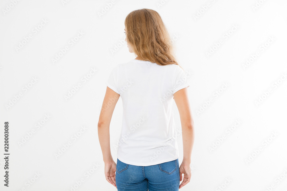 Fototapeta premium back view of young caucasian, europian woman, girl in blank white t-shirt. t shirt design and people concept. Shirts front view isolated on white background. Mock up. Copy space.