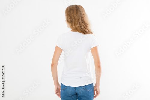 back view of young caucasian, europian woman, girl in blank white t-shirt. t shirt design and people concept. Shirts front view isolated on white background. Mock up. Copy space. © paulcannoby