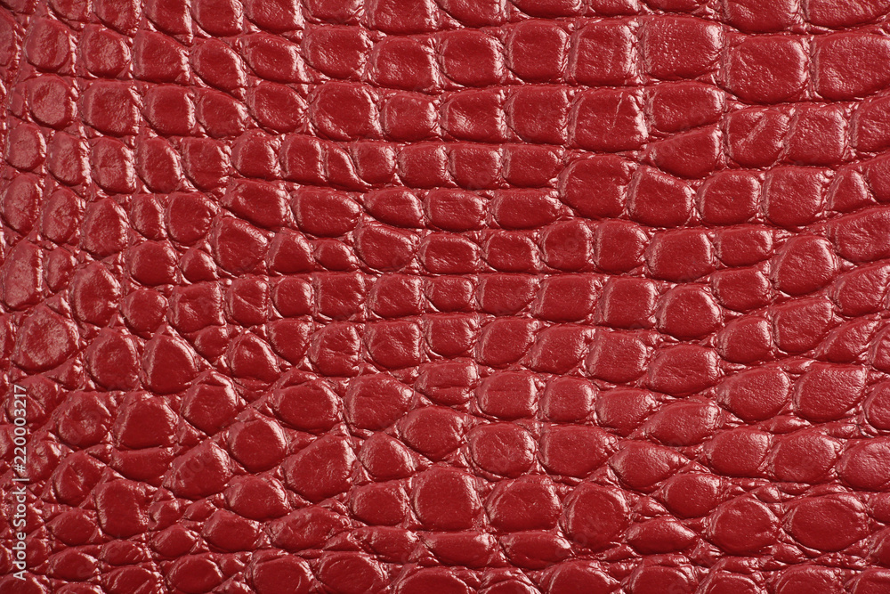texture of red maroon genuine leather, like crocodile skin Stock Photo
