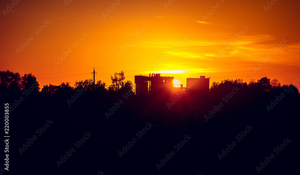 Summer evening sunset in a field. Russian landscapes. A natural phenomenon. Orange sky. Summer evening Summer evening sunset in a field. Russian landscapes. A natural phenomenon. Orange sky. Summer evening