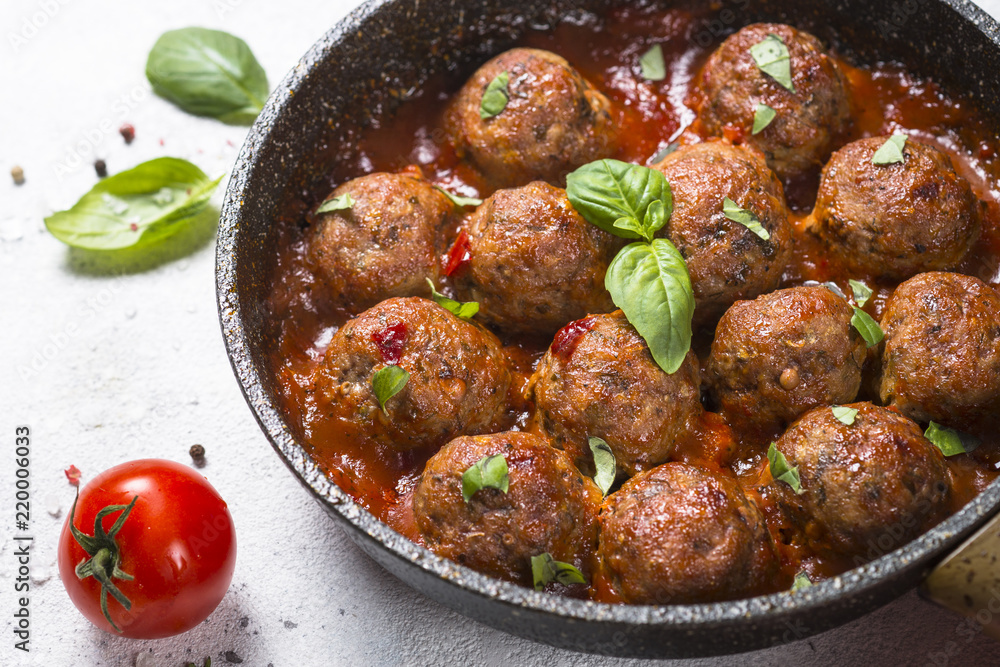 Meatballs in tomato sauce on white table. Meatballs in tomato sauce on white table.