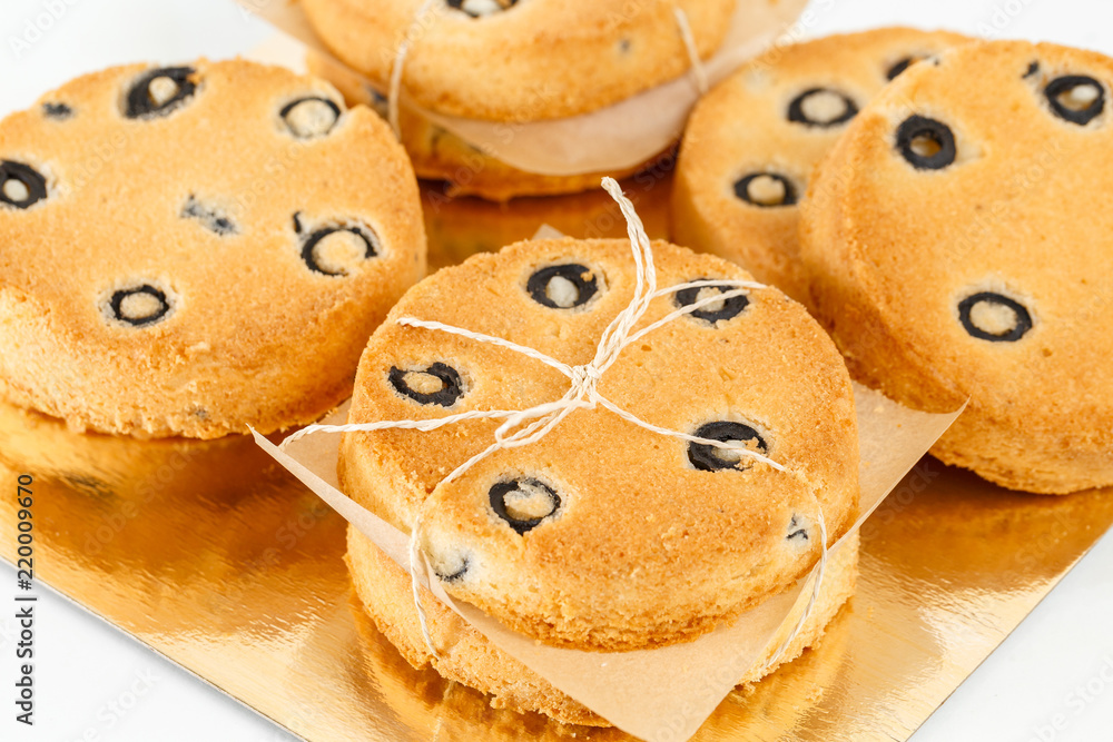 Round shortbread biscuits with black olives. fresh homemade cookies Round shortbread biscuits with black olives. fresh homemade cookies