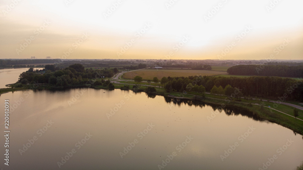 Aerial shot over a lake during sunset