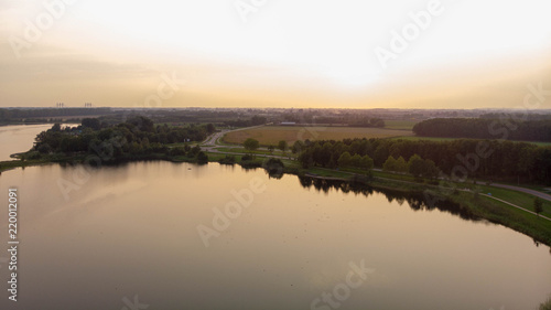 Aerial shot over a lake during sunset
