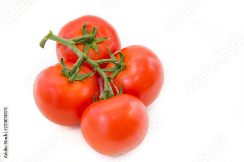 Tomatoes on a branch isolated on white background. Vegetables on a white background. Food . Healthy eating.