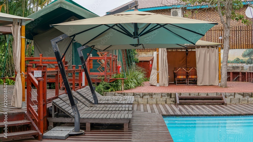 A hostel garden by pool