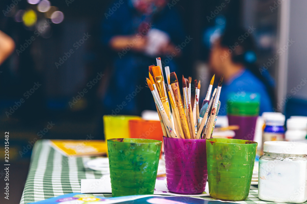 brushes on the table of the artist brushes on the table of the artist