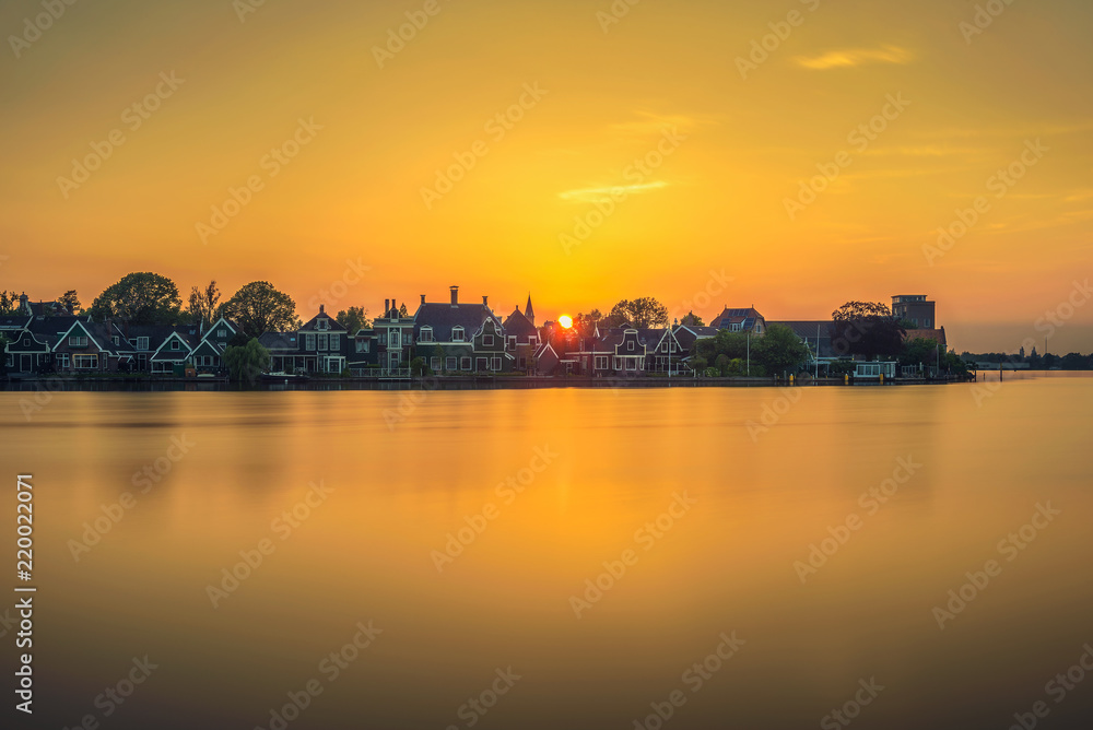 Sunset above the beautiful village of Zaanse Schans in Holland Sunset above the beautiful village of Zaanse Schans in Holland