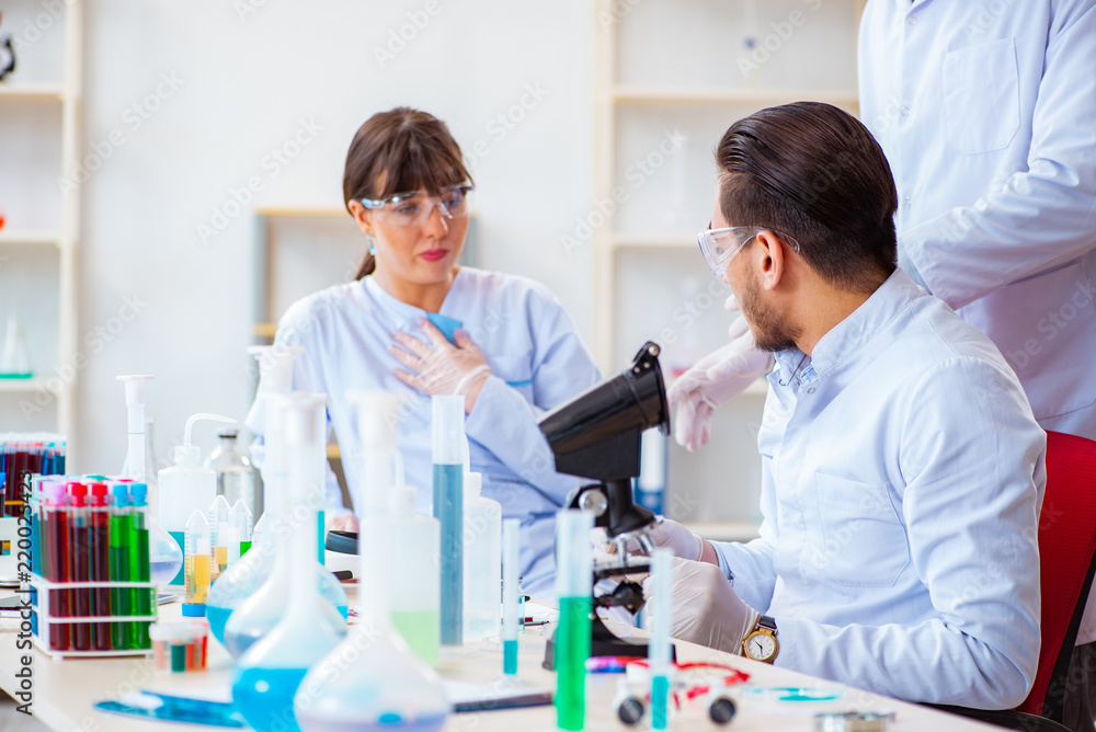 Team of chemists working in the lab Team of chemists working in the lab