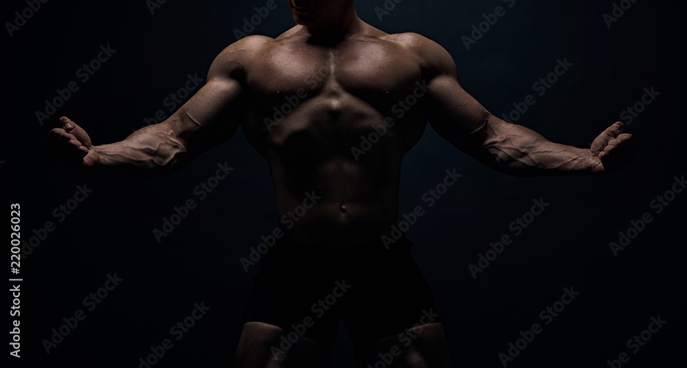 Muscular bodybuilder guy doing exercises Muscular bodybuilder guy doing exercises