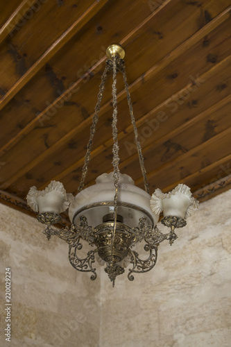 Close-up of a beautiful chandelier. luxury expensive chandelier hanging under ceiling