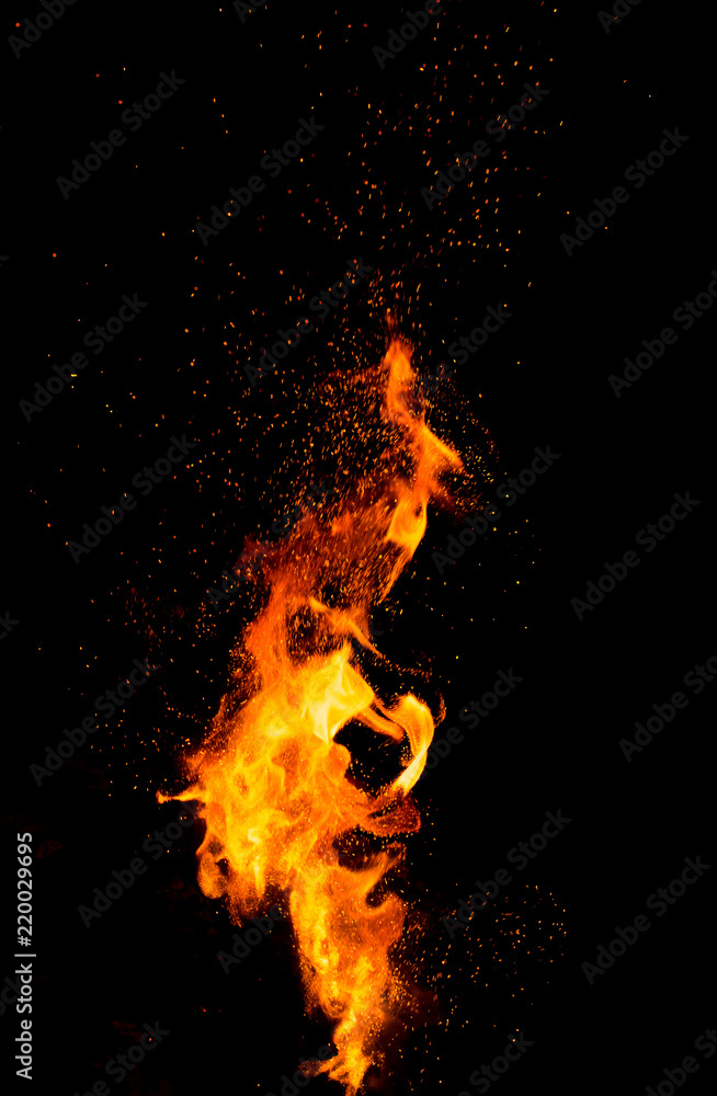 Flame of fire with sparks on a black background