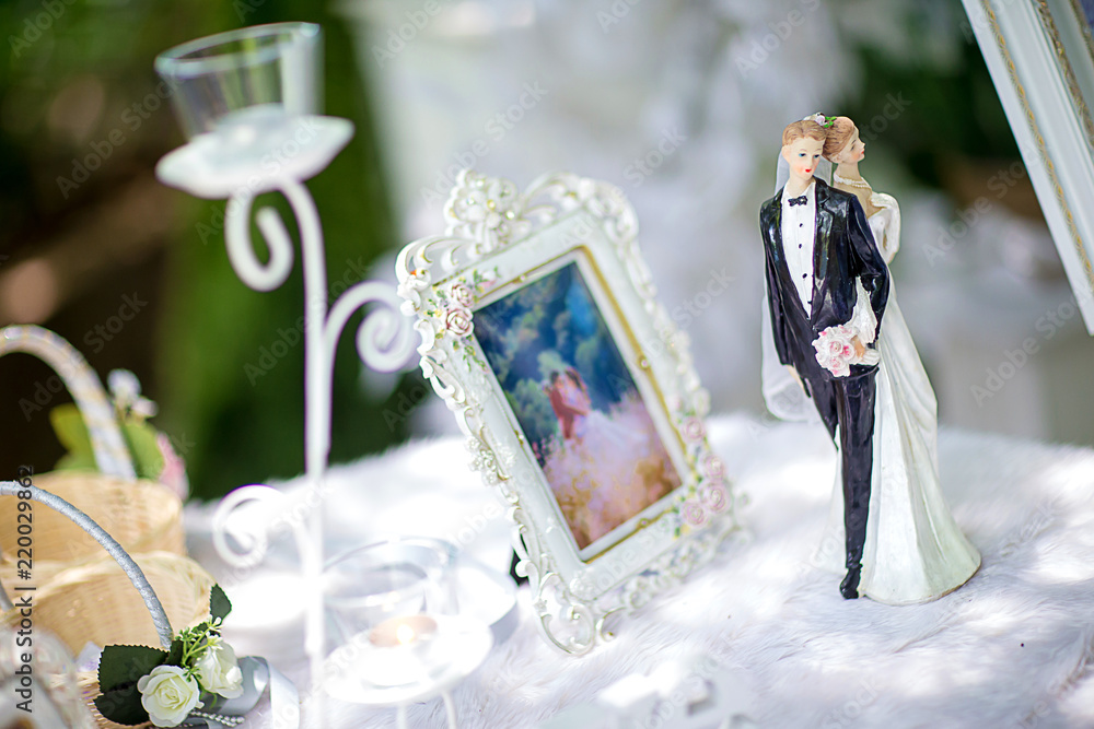Miniature wedding doll with blur background. wedding bride and groom couple  doll on table in wedding Party Stock Photo | Adobe Stock