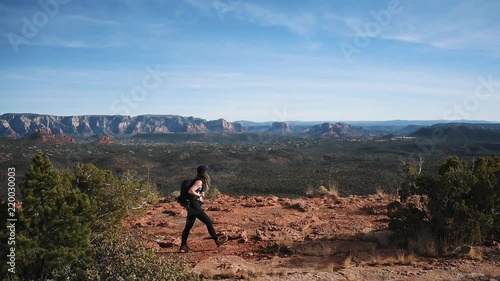 Woman Hiking on Desert Mountaintop Trail