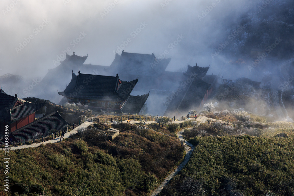 Fanjingshan, Mount Fanjing Nature Reserve - Sacred Mountain of Chinese Buddhism in Guizhou Province, China. UNESCO World Heritage List - China National Parks, Buddhist temple hidden in the mist