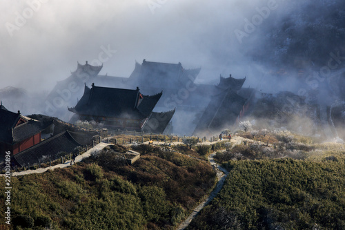 Fanjingshan  Mount Fanjing Nature Reserve - Sacred Mountain of Chinese Buddhism in Guizhou Province  China. UNESCO World Heritage List - China National Parks  Buddhist temple hidden in the mist