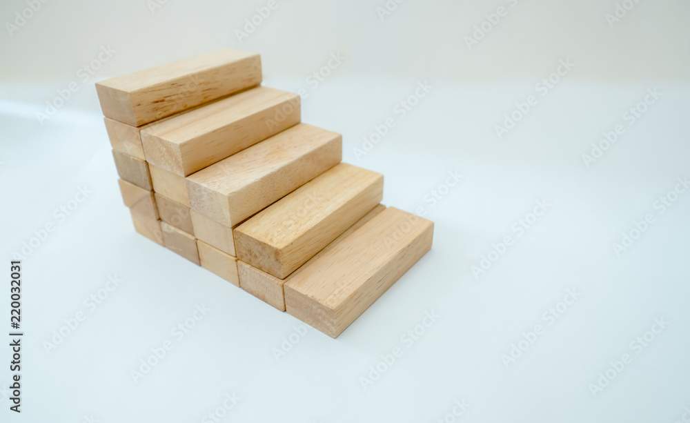 Wood block stacking as step stair with Business concept for growth success process Wood block stacking as step stair with Business concept for growth success process