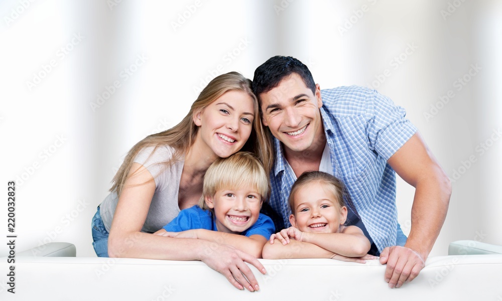 Beautiful smiling family on background Beautiful smiling family on background