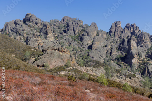 High Peaks Pinnacles with California Buckwheat and Summer Blue Skies, looking east from near Chaparral Trailhead Parking. Pinnacles National Park, California, USA.