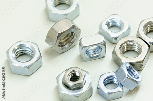 Finished Hex and square nut, most common shape of fastener. Used in conjunction a mating bolt to fasten multiple parts together.