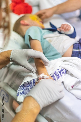 Young Boy in Hospital with Broken Arm Getting Cannula Removed © Lynda
