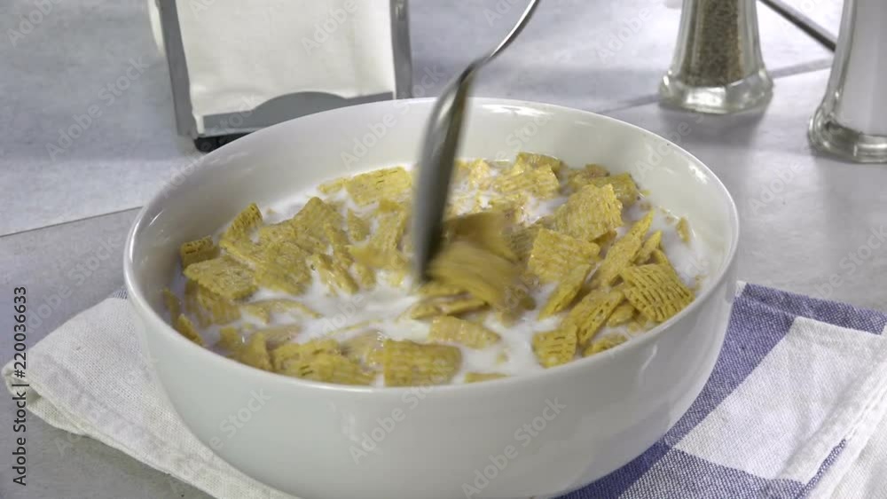 Taking a spoonful of cold breakfast cereal
Taking a spoonful of cold breakfast cereal