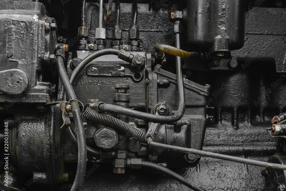 Background surface of old, black and oily machine engine