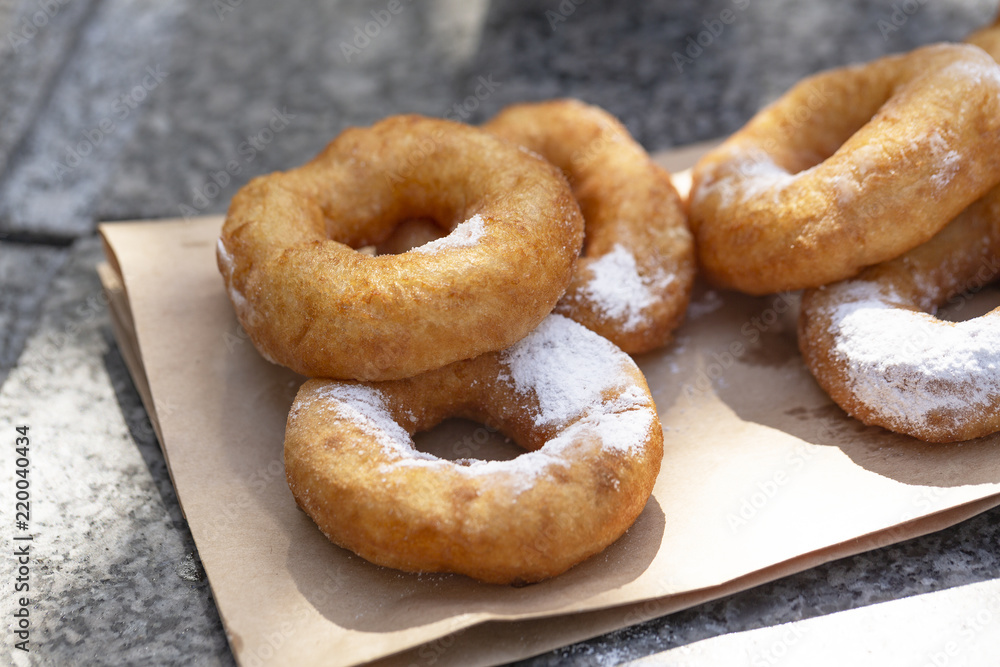Doughnuts with sugar powder and coffee. Street food Doughnuts with sugar powder and coffee. Street food