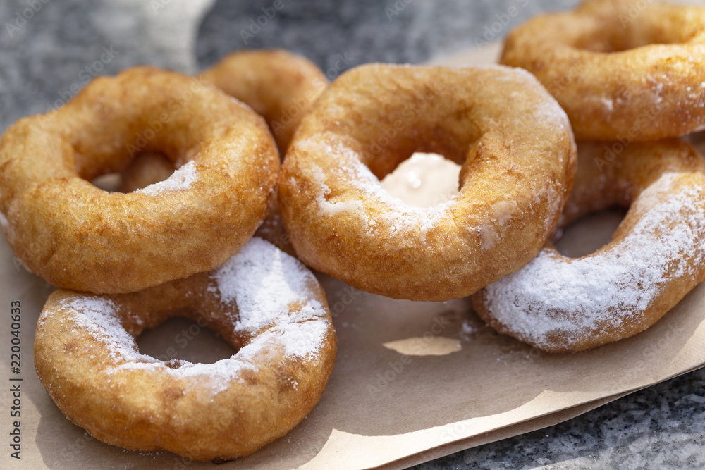 Doughnuts with sugar powder and coffee. Street food Doughnuts with sugar powder and coffee. Street food