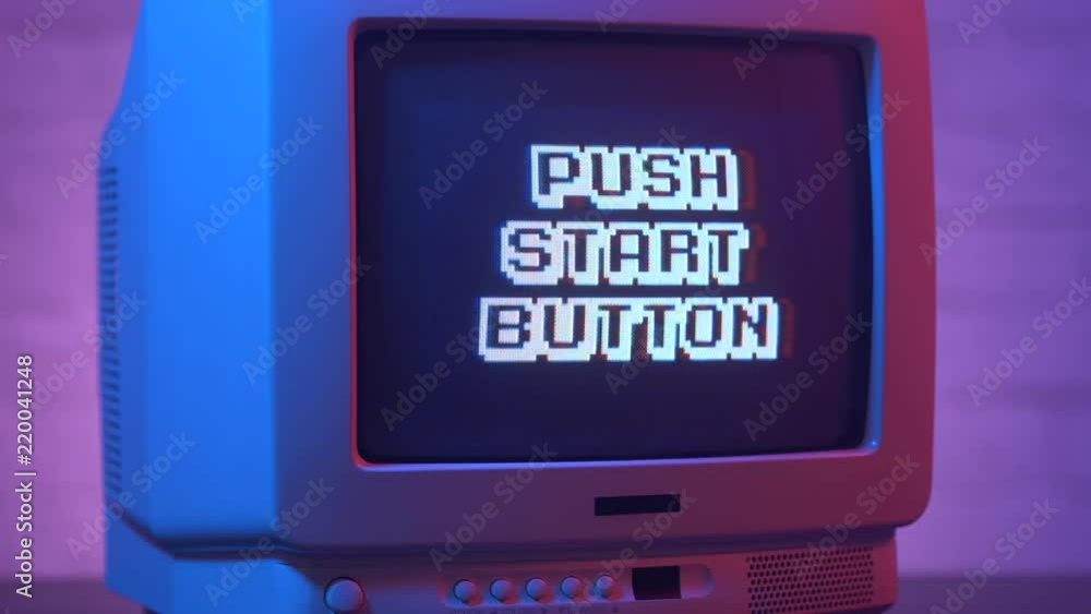 Push start button flashing on a retro video game TV from the 80s or 90s