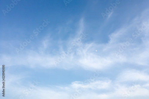 Authentic and dramatic image panorama atmosphere view of summer blue sky and clouds with moon in outdoor daylight.