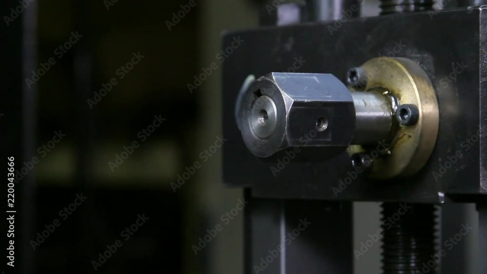 Close-up of metal-rolling machines for production metal steel pipes in factory. Seamless technology for production of profile pipe.