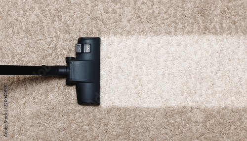 Obraz na płótnie Cleaning white with pile carpet vacuuming at home