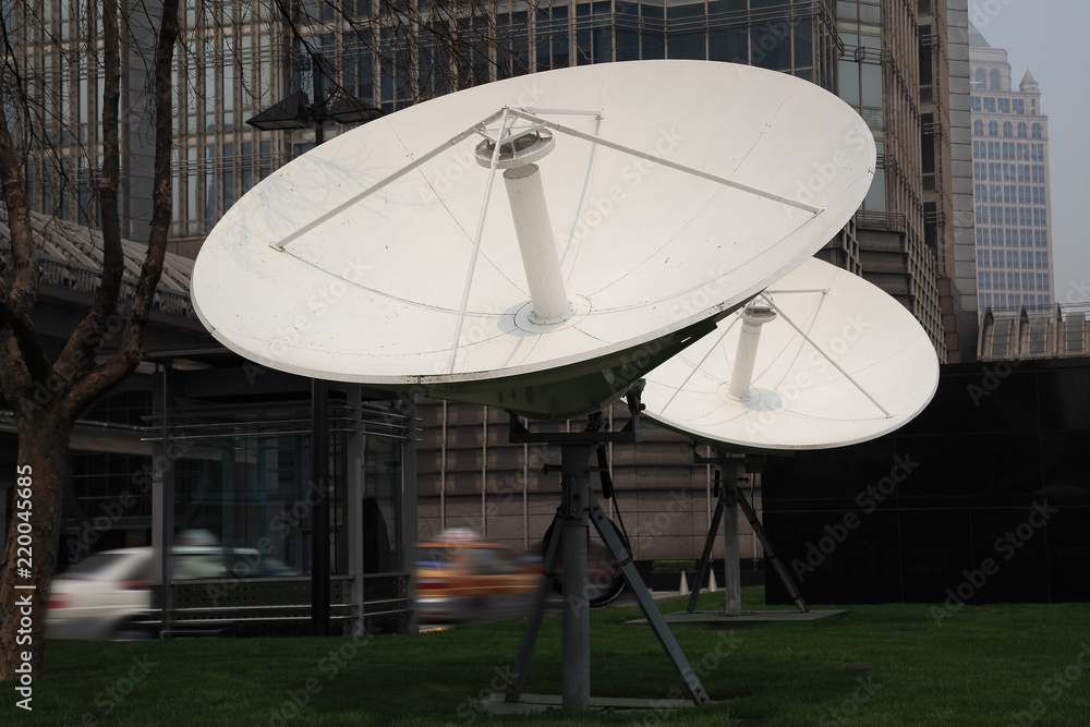 Satellite dish space technology receivers with modern buildings backgrounds