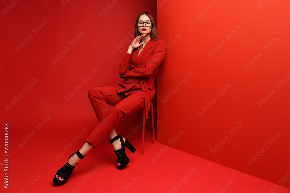 Fashion young woman in red suit. Fashion young woman in red suit.