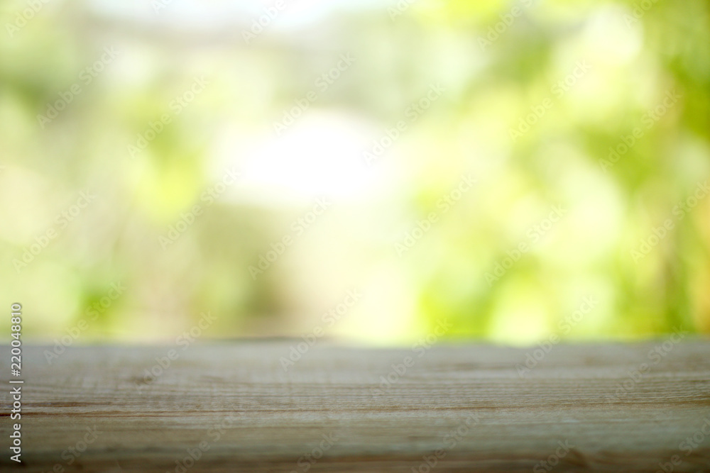 summer space for copying/ wooden table on a background of blurred outlines of nature summer space for copying/ wooden table on a background of blurred outlines of nature