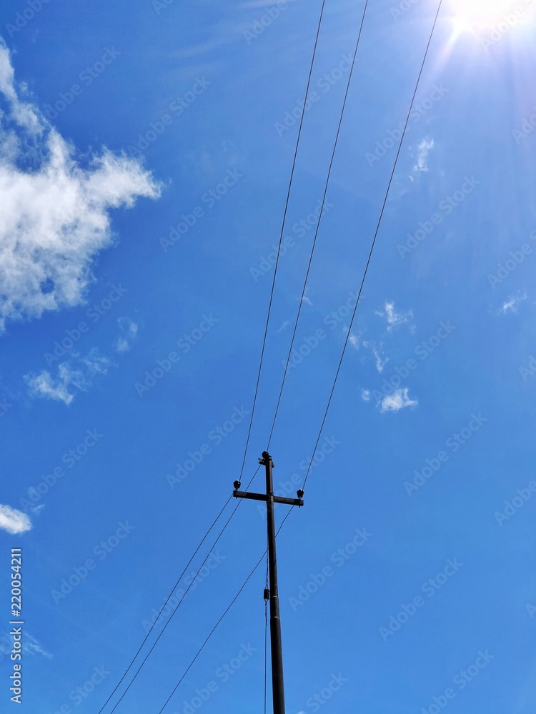An electric pylon on a sunny afternoon. An electric pylon on a sunny afternoon.